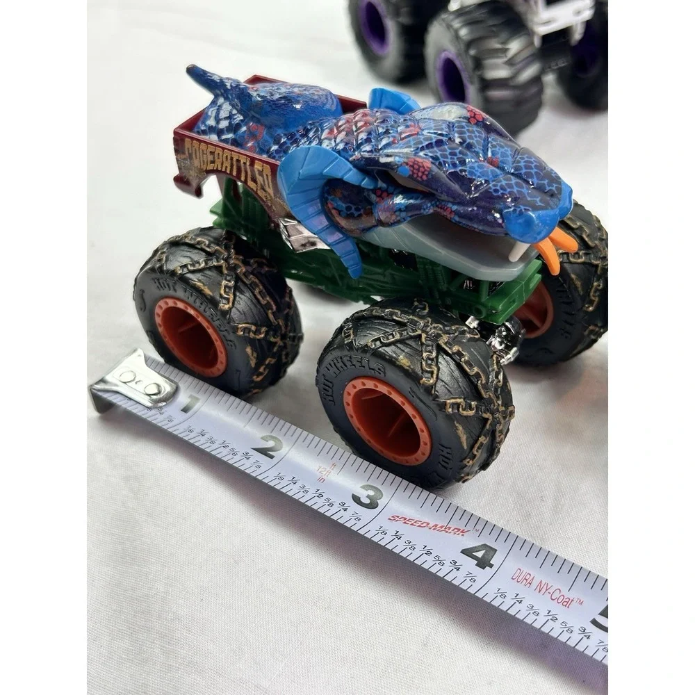 Lot Of 4 Diecast Monster Trucks 3 Hot wheels El Toro Grave Digger Rattlesnake